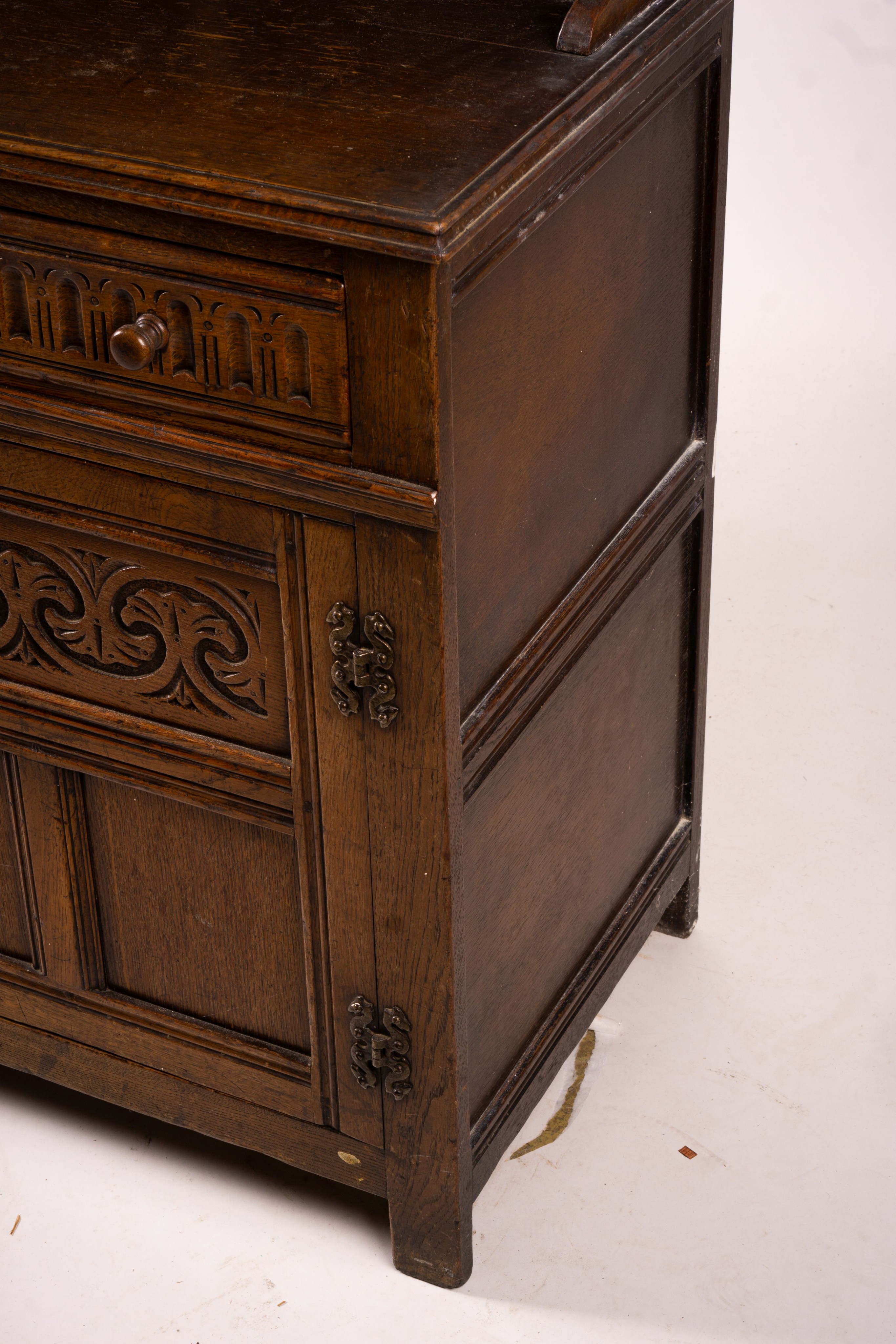 An 18th century style carved oak dresser, width 124cm, depth 46cm, height 175cm